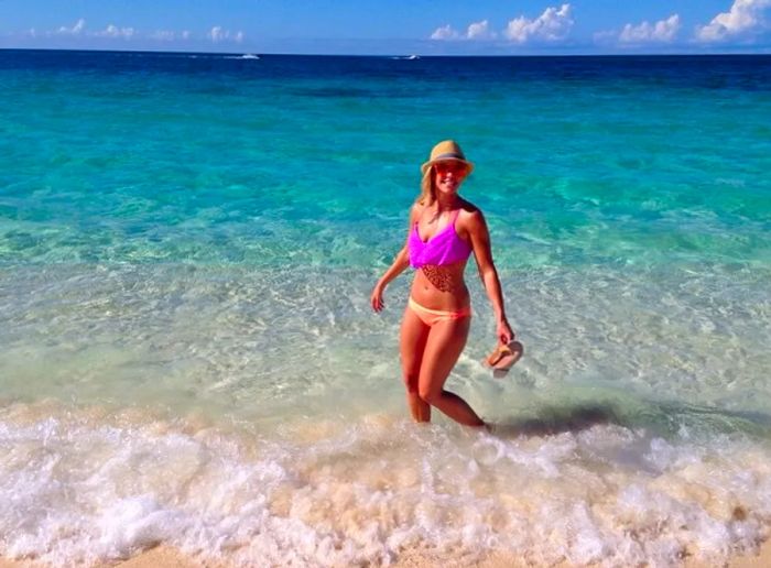 happy woman enjoying the waters of the Bahamas.jpg