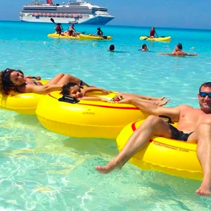 Family enjoying water floats at Half Moon Cay