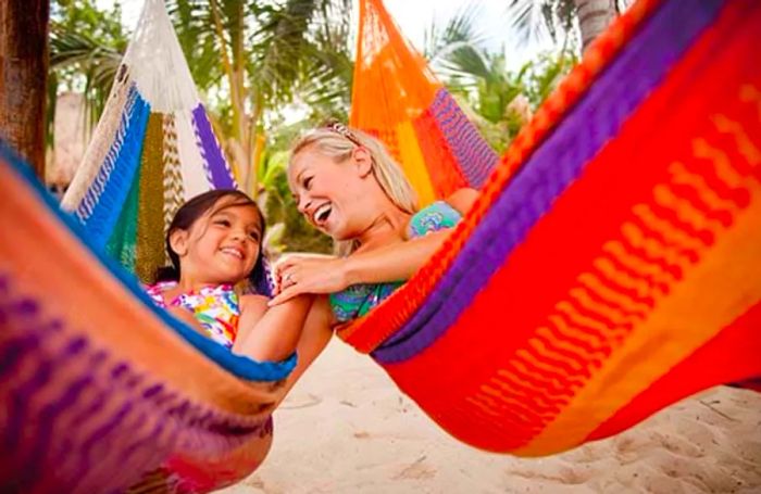 two girls lounging in their hammocks