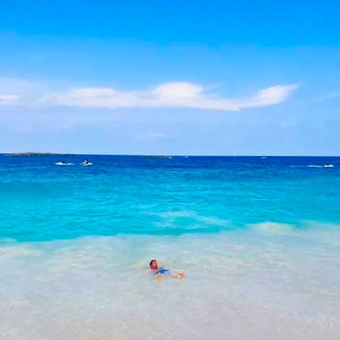 A man enjoying the gentle waters at the beach