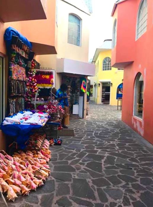 A quaint shopping area adorned with conch shells