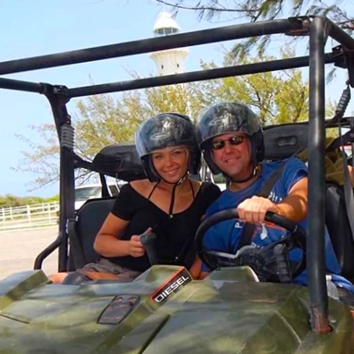 a couple enjoying their ATV adventure in Grand Turk