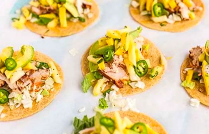 A spread of pineapple mango chicken tacos, ready to enjoy