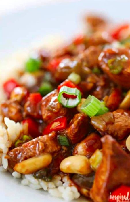 Close-up of a Kung Pao Chicken dish served over rice