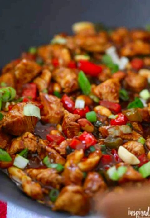 Kung Pao Chicken sizzling in a large skillet