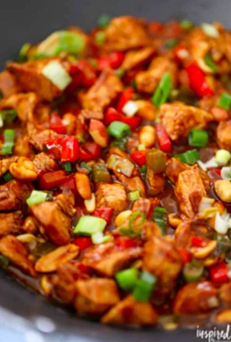 Bird's-eye view of Kung Pao Chicken cooking in a large skillet