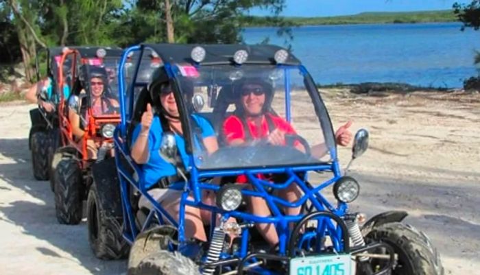 A group of tourists discovering Princess Cays on dune buggies