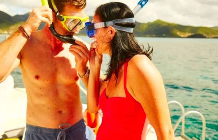 couple donning snorkeling equipment