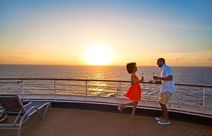 a couple dancing on the deck of a Dinogo cruise ship