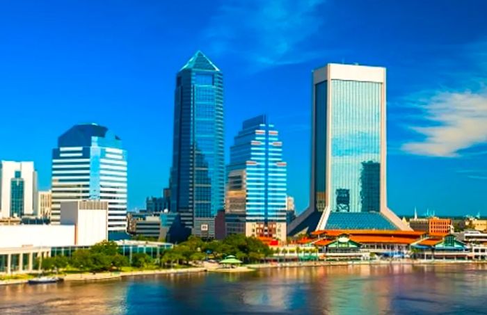 Panoramic view of the Jacksonville skyline from across the river on a sunny day