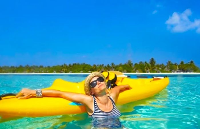 woman relaxing on her kayak during a shore excursion in the Bahamas