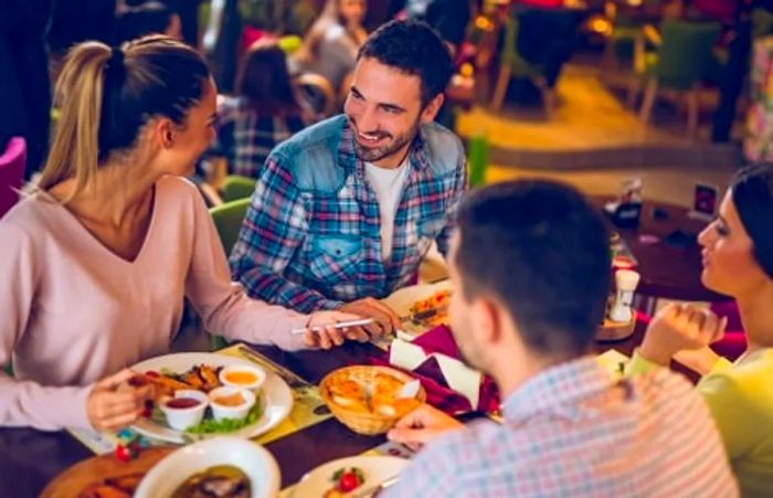 A group of friends enjoying Southern cuisine at a Jacksonville restaurant