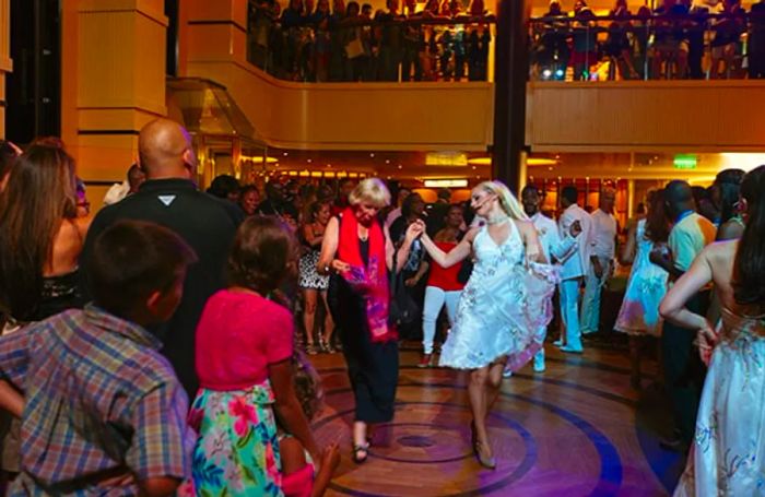 guests dancing in the atrium alongside professional dancers