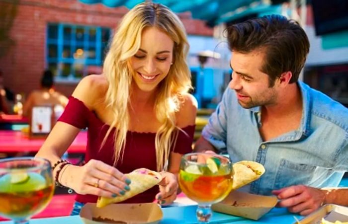 A couple enjoying fish tacos at a Jacksonville restaurant