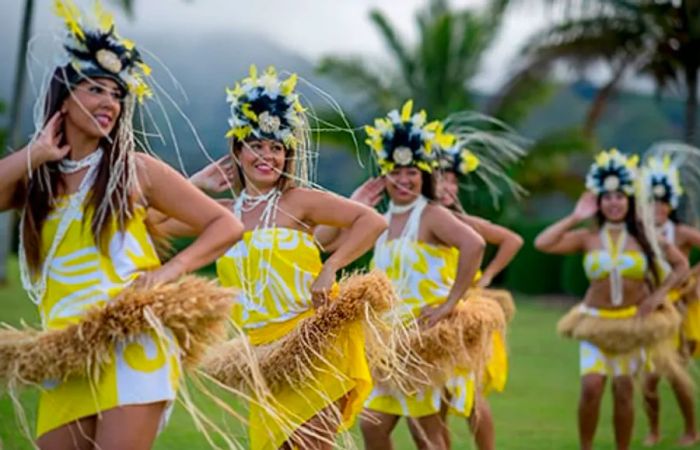 a group of hula dancers performing at a luau