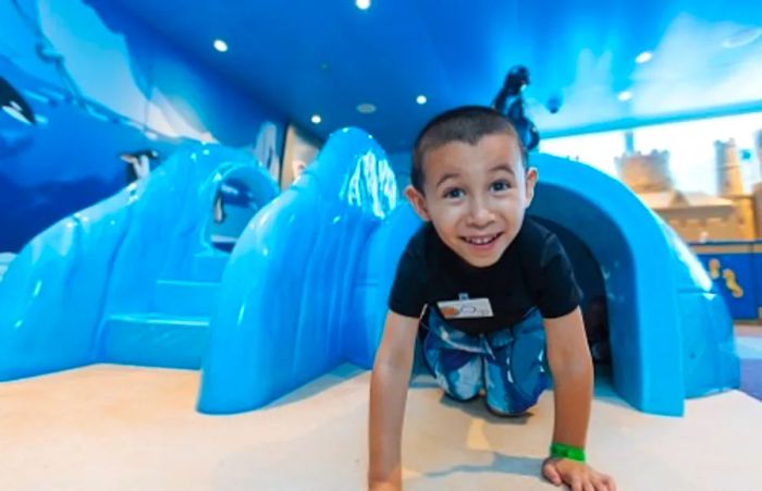 a little boy exploring and enjoying games at Camp Ocean