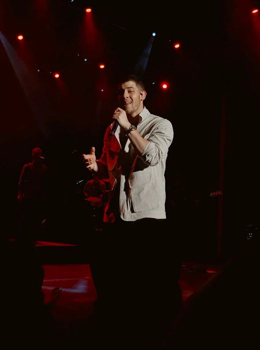 Nick Jonas performing on stage