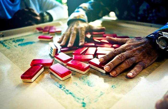 individuals enjoying a game of dominos in Little Havana