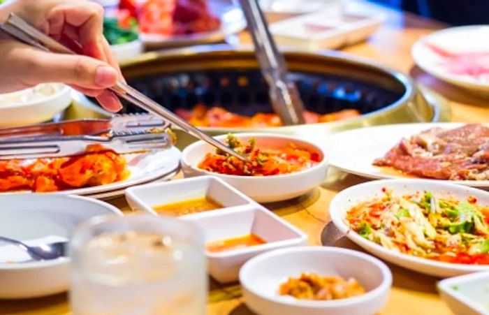 guests preparing food at a local Korean buffet in Seattle