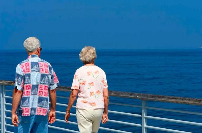 senior couple strolling on the cruise deck