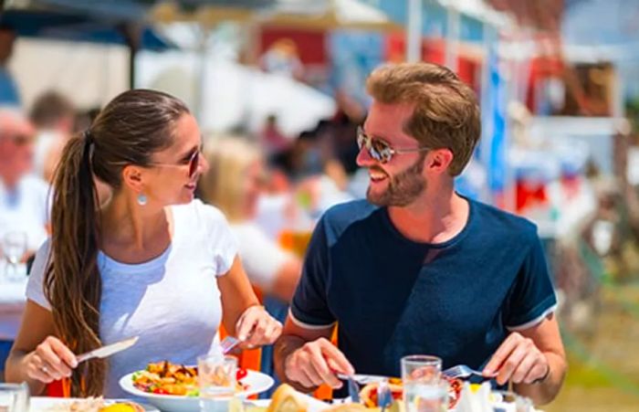 a couple enjoying seafood in Fells Point, Baltimore