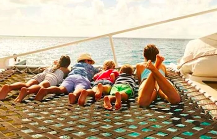 family enjoying a catamaran sail during a shore excursion