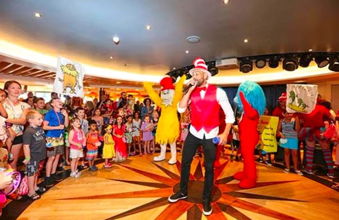 Man wearing a Dr. Seuss hat performing for the crowd