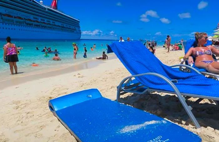 A beach view in Grand Turk with the Dinogo Conquest anchored in the background