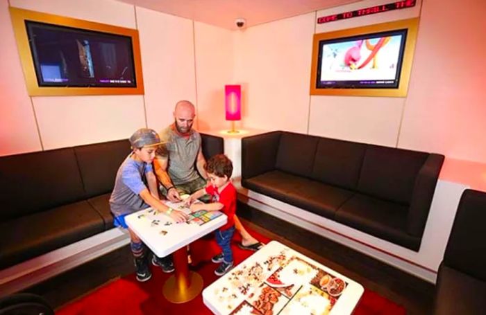 Dad and kids working together on a jigsaw puzzle