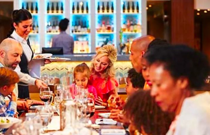 family relishing a meal onboard