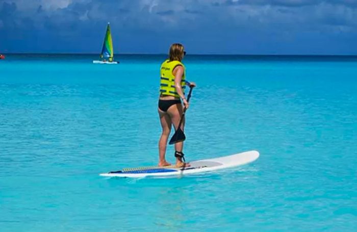 Sarah paddle boarding at Half Moon Cay.