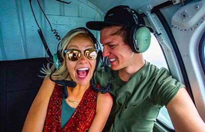 Brad and Hailey enjoying their helicopter adventure in Grand Cayman