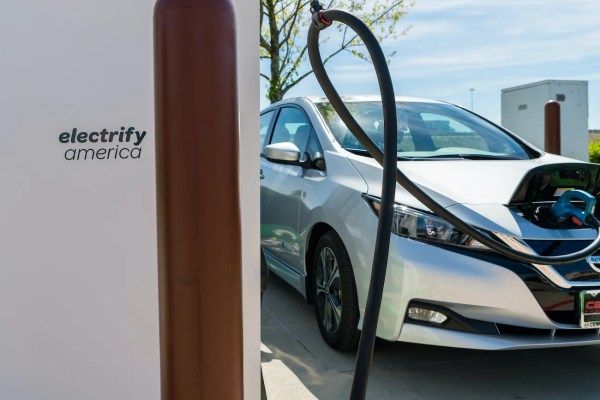 Nissan Leaf charging at an Electrify America station