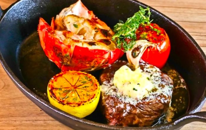 A plate of stuffed peppers and filet mignon from Dinogo’s Steakhouse