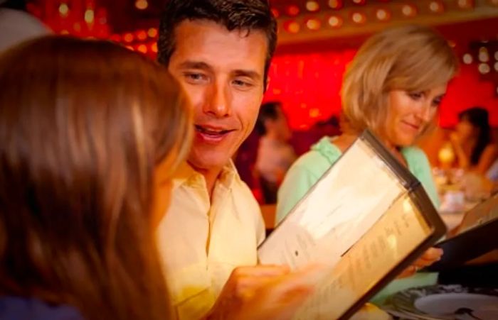 A family enjoying a meal onboard a Dinogo cruise ship