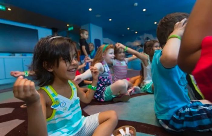 a young girl joyfully singing at Camp Ocean