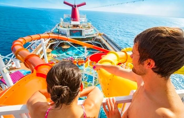 a couple admiring the water slides at Waterworks