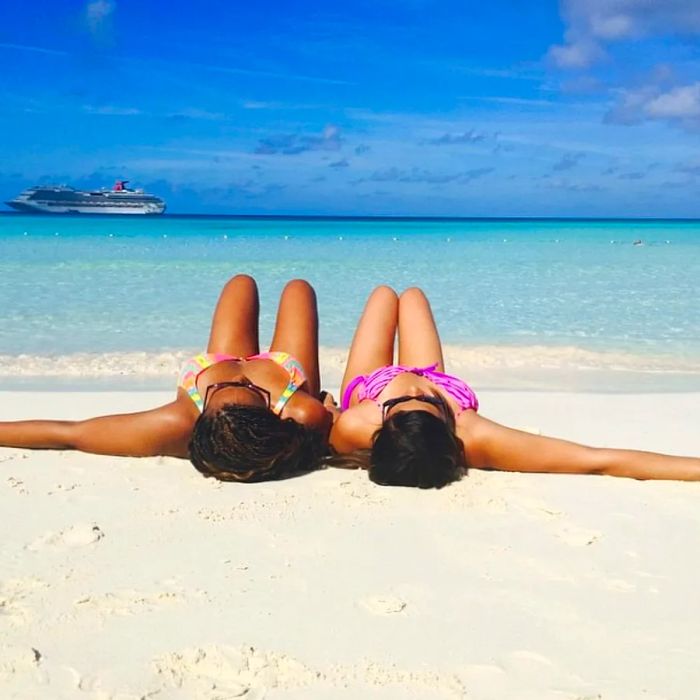 two women relaxing on a beach at Half Moon Cay