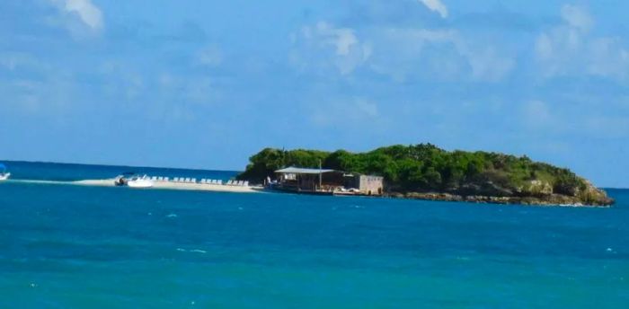 A boat docked on the secluded Robinson Crusoe island in Antigua.