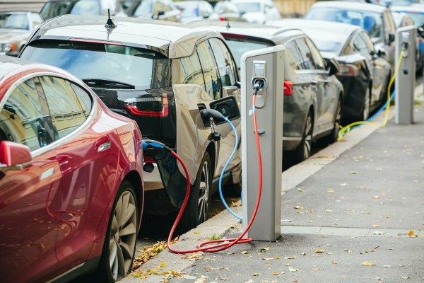 Electric vehicles recharging on urban streets