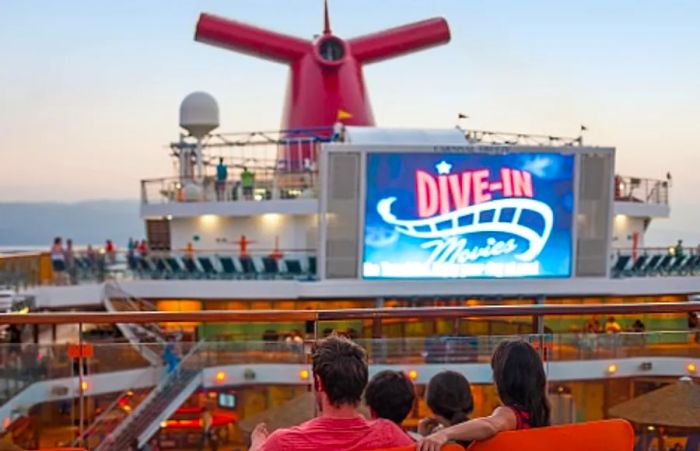 a family getting comfortable to enjoy a feature film aboard a Dinogo ship