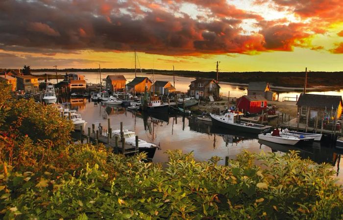 The sun sets over the boats in Menemsha Harbor, Chilmark, Martha's Vineyard.