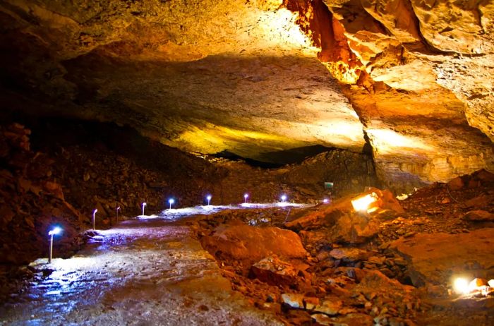 A softly illuminated pathway within the Vjetrenica Cave.