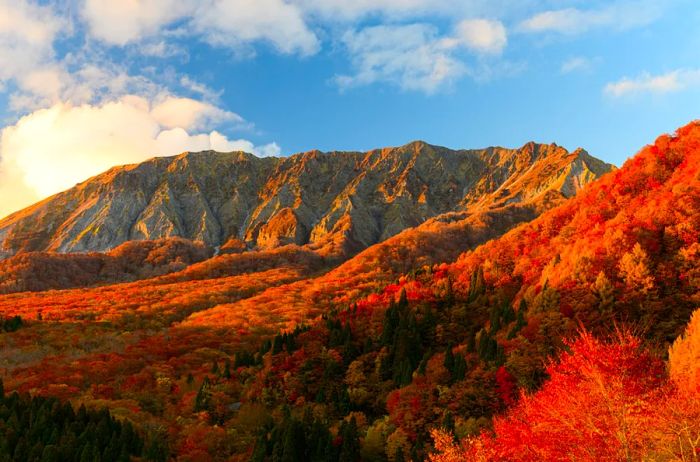 A view of Mount Daisen and its autumn foliage against the setting sun from Kagikake Pass