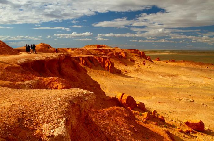 People standing on a desert cliff