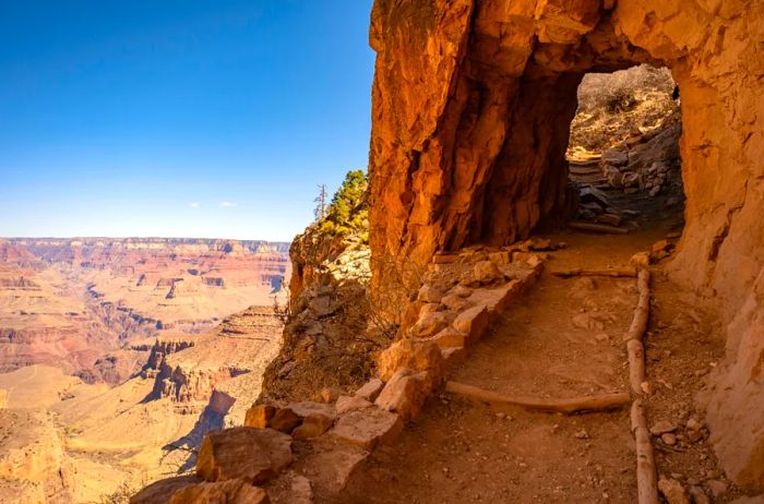 A rock-carved tunnel that provides stunning views over the Grand Canyon.