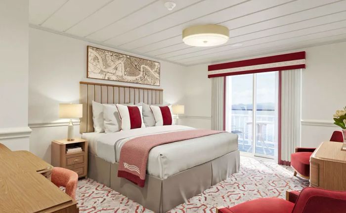 A stateroom aboard an American Cruise Lines paddle wheeler features a queen bed adorned with red, white, and light gray accents, along with a private walkout balcony.