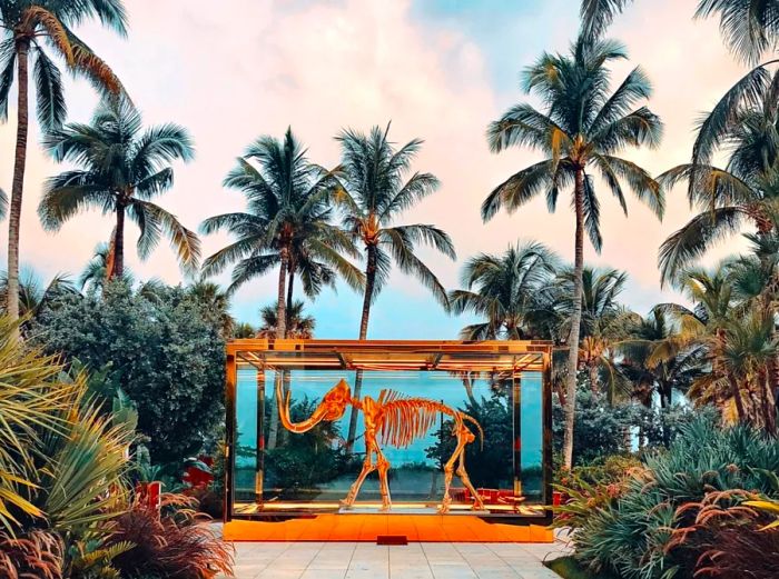 Damien Hirst's art installation, Gone but not Forgotten, showcases a striking gilt woolly mammoth skeleton at the Faena Miami.