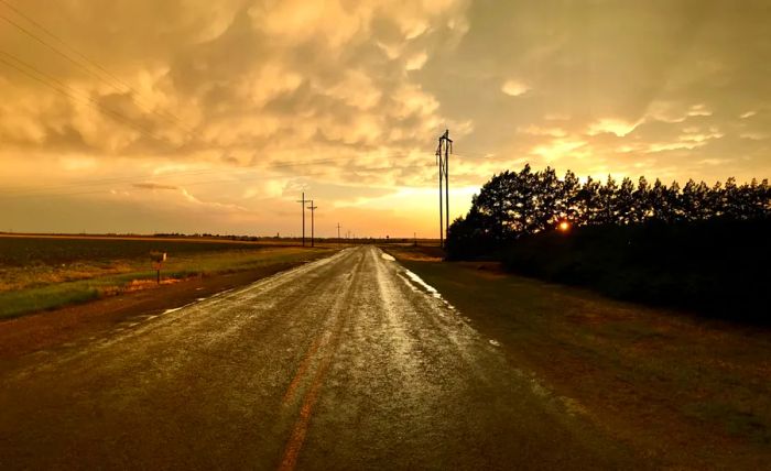 A cloudy sky with an empty road following a rainstorm in Lubbock, Texas