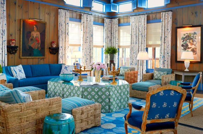 The Blue Room at Lake Austin Spa Resort, featuring blue couches, chairs, and tables, along with curtained windows